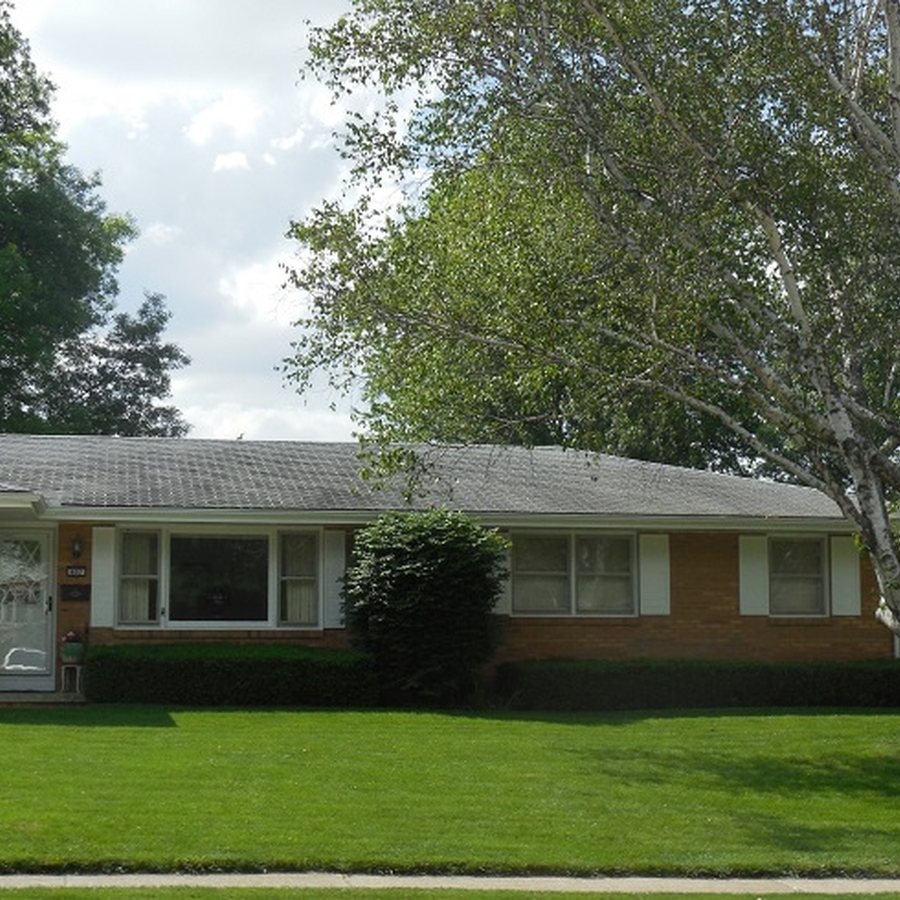 Brick home exterior and foundation line, where a Lancaster perimeter barrier is applied
